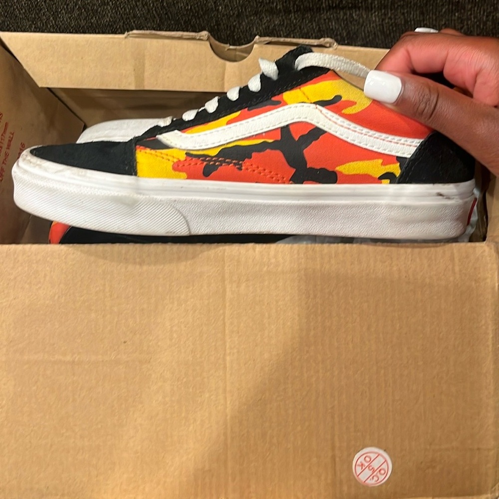 These are Vans they are a size 7 and are red orange and yellow.